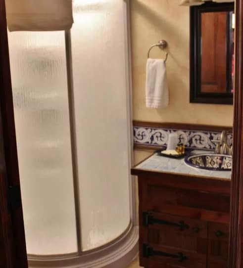 Bathroom with tile accents and wood vanity at Blue Sky Vineyard Suite.