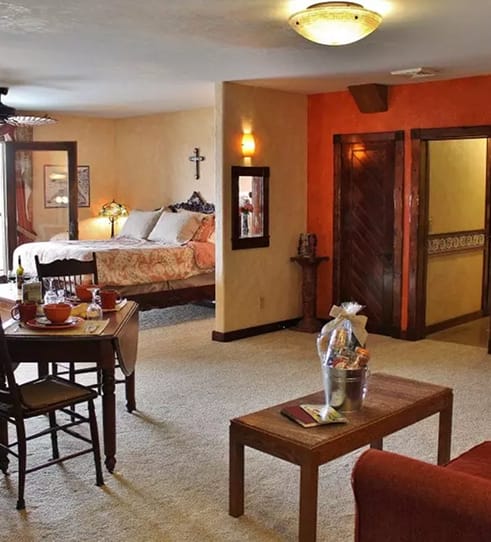 Spacious winery suite with dining area and bedroom at Blue Sky Vineyard.