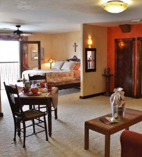 Spacious winery suite with dining area and bedroom at Blue Sky Vineyard.